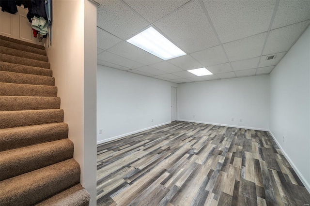 8 Nick Ridge Dr, Washington, MO 63090 - finished below grade area featuring stairway, wood finished floors, a paneled ceiling, and baseboards