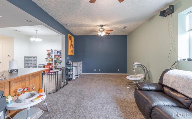 22354 Target Rd, Saint Robert, MO 65584 - carpeted living area featuring ceiling fan, a textured ceiling, a chandelier, and baseboards
