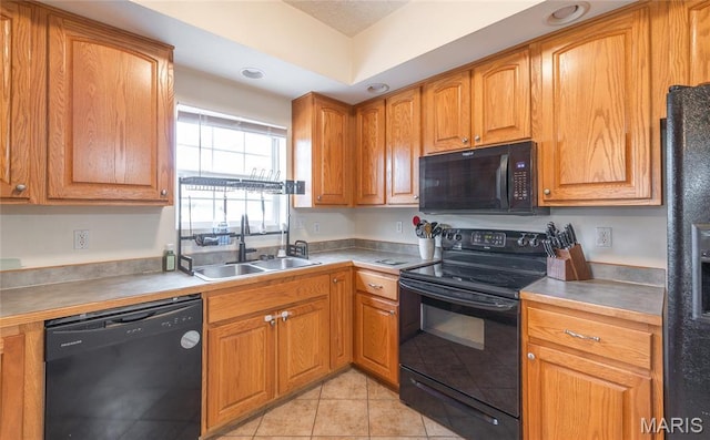 22354 Target Rd, Saint Robert, MO 65584 - kitchen with black appliances, a sink, light tile patterned floors, brown cabinets, and light countertops