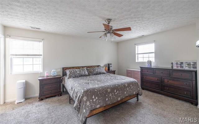 22354 Target Rd, Saint Robert, MO 65584 - bedroom featuring carpet floors, a textured ceiling, and a ceiling fan