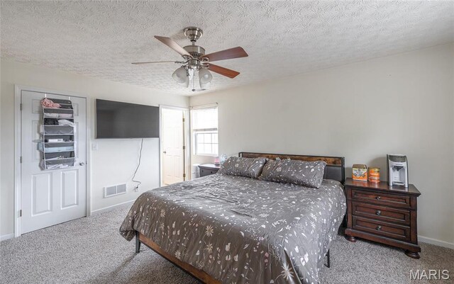 22354 Target Rd, Saint Robert, MO 65584 - bedroom with carpet floors, baseboards, a textured ceiling, and a ceiling fan
