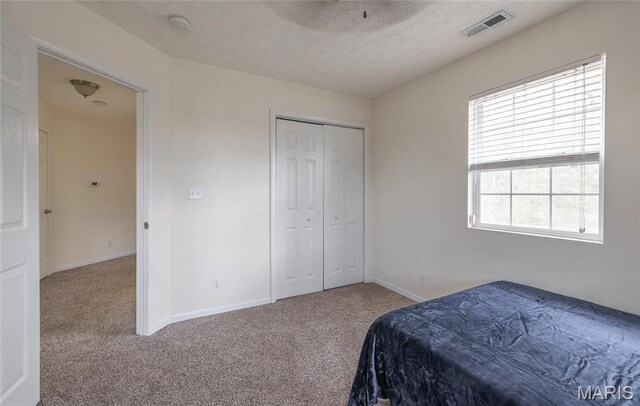 22354 Target Rd, Saint Robert, MO 65584 - carpeted bedroom with a textured ceiling, baseboards, and a closet