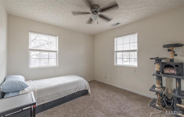 22354 Target Rd, Saint Robert, MO 65584 - bedroom with carpet, a textured ceiling, baseboards, and ceiling fan