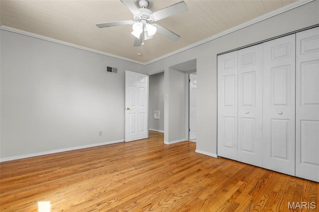 1220 Spring Valley Dr, Florissant, MO 63033 - unfurnished bedroom with light wood finished floors, a closet, baseboards, a ceiling fan, and crown molding