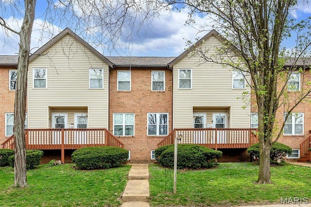 10161 Squire Meadows Dr Unit C, Saint Louis, MO 63123 - rear view of property featuring a wooden deck, a yard, and brick siding