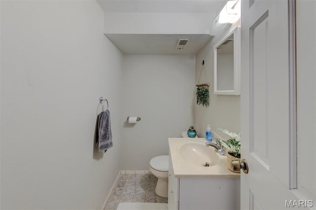 10161 Squire Meadows Dr Unit C, Saint Louis, MO 63123 - bathroom with baseboards, toilet, vanity, and tile patterned floors