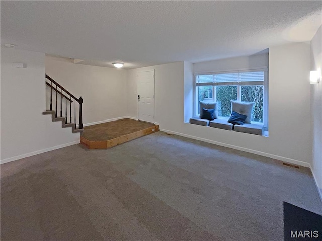 26 Thistledale Ct Unit H, Saint Peters, MO 63376 - carpeted entryway featuring stairway and a textured ceiling