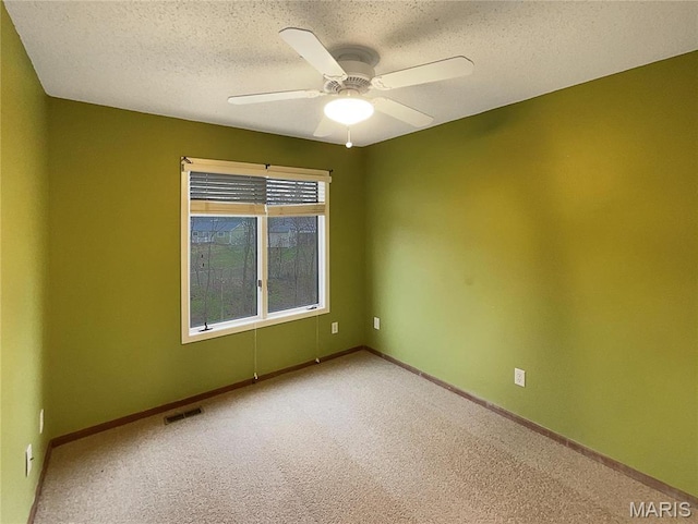 26 Thistledale Ct Unit H, Saint Peters, MO 63376 - carpeted empty room with a textured ceiling and ceiling fan