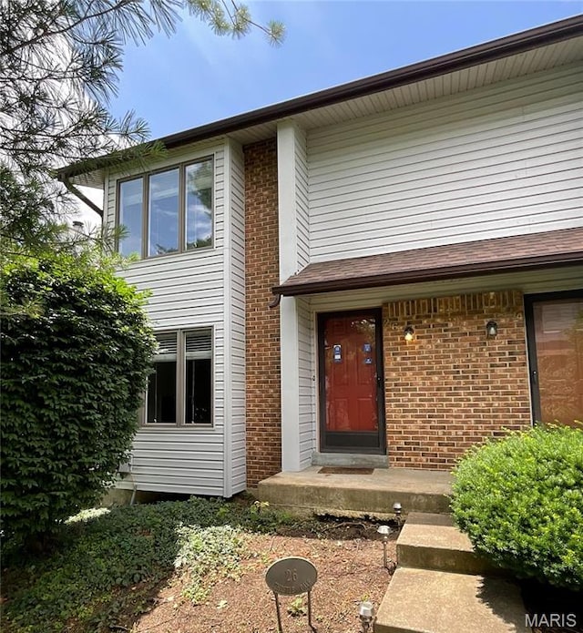 26 Thistledale Ct Unit H, Saint Peters, MO 63376 - view of exterior entry featuring brick siding