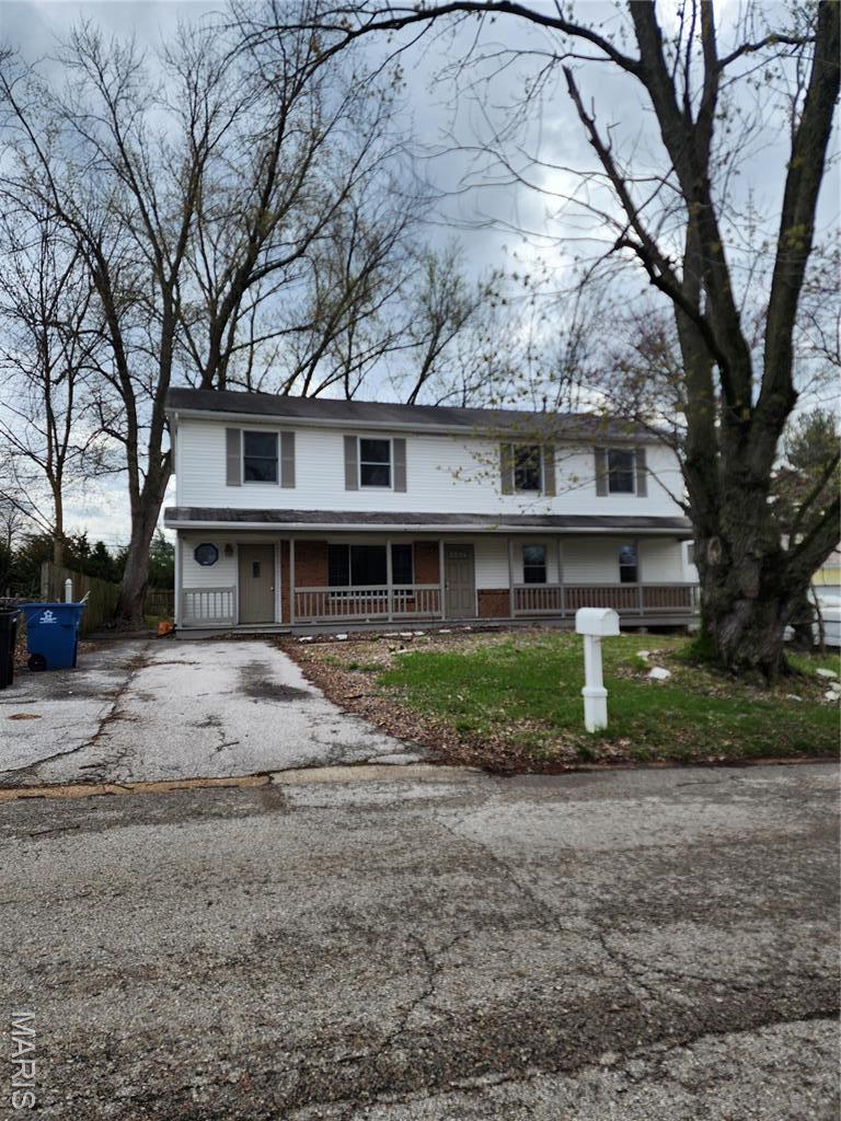 1414 Reale Ave, Saint Louis, MO 63138 - view of front of property featuring a porch and driveway