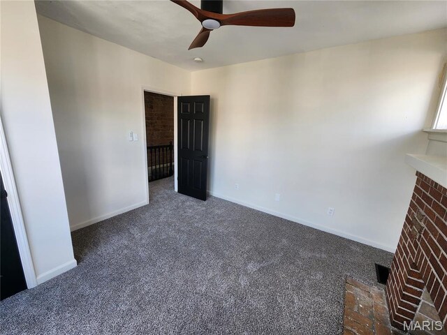4713 Virginia Ave, Saint Louis, MO 63111 - unfurnished bedroom with carpet, a fireplace, baseboards, and ceiling fan