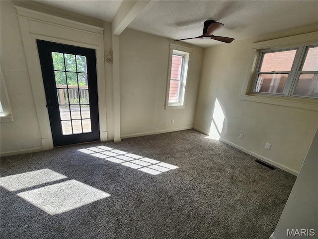 4713 Virginia Ave, Saint Louis, MO 63111 - carpeted empty room with a ceiling fan, baseboards, and a textured ceiling