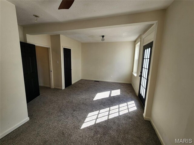4713 Virginia Ave, Saint Louis, MO 63111 - carpeted spare room with baseboards and a ceiling fan