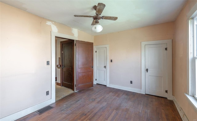 104 E Jefferson Ave, Richland, MO 65556 - unfurnished bedroom with wood finished floors, baseboards, and ceiling fan