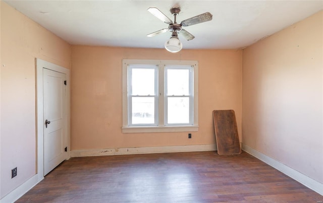 104 E Jefferson Ave, Richland, MO 65556 - unfurnished room with wood finished floors, a ceiling fan, and baseboards