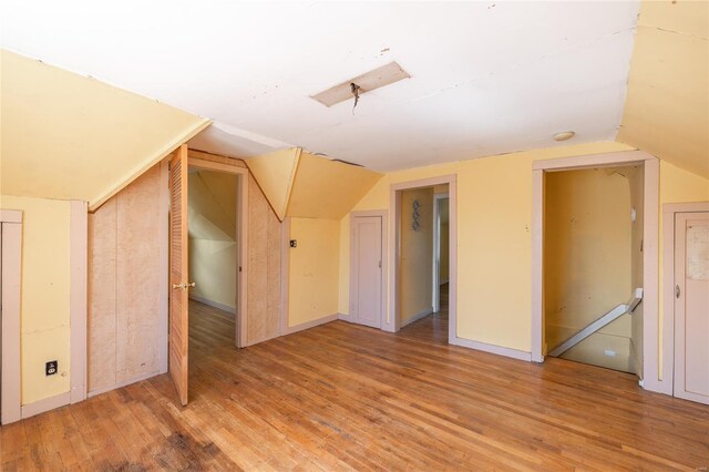 104 E Jefferson Ave, Richland, MO 65556 - bonus room featuring lofted ceiling and wood finished floors