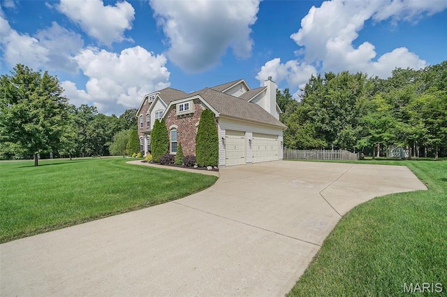 view of side of home featuring concrete driveway, brick siding, a garage, and a chimney