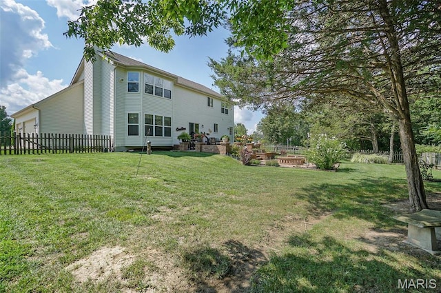 back of property with a garage