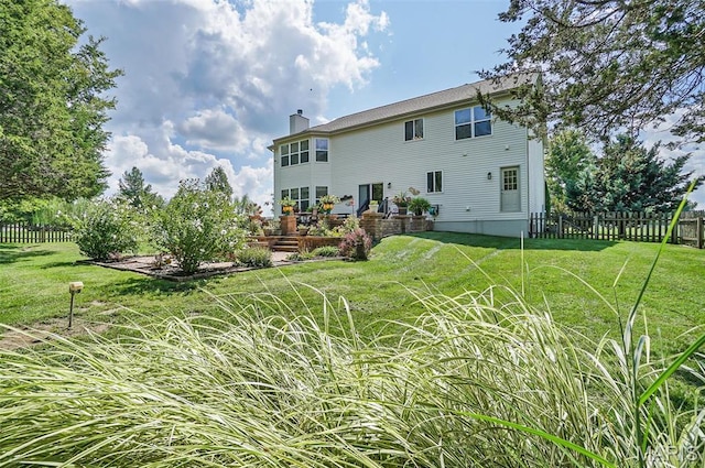 rear view of property with a chimney