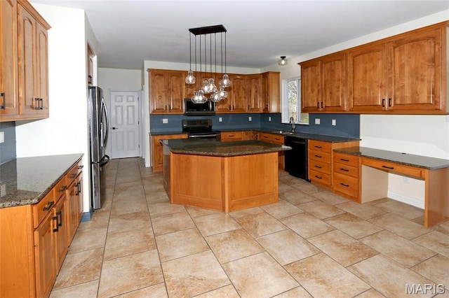 kitchen featuring stainless steel appliances, a center island, dark stone countertops, brown cabinetry, and hanging light fixtures
