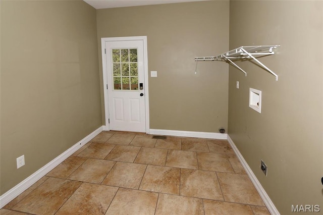 clothes washing area with baseboards, electric dryer hookup, hookup for a washing machine, and tile patterned floors