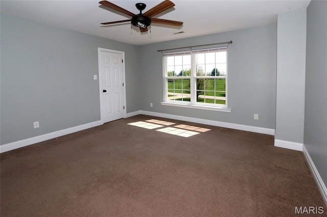 221 Stoneledge Ct, Marthasville, MO 63357 - spare room with baseboards, a ceiling fan, and dark colored carpet