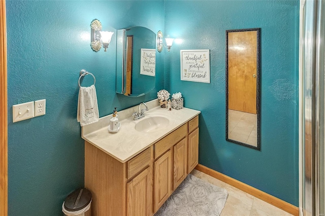 3448 Levee Rd, Centralia, IL 62801 - bathroom featuring vanity, baseboards, tile patterned floors, and a textured wall