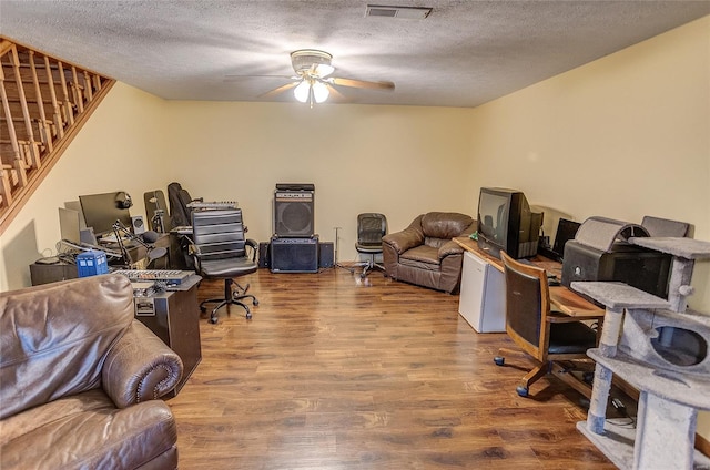 3448 Levee Rd, Centralia, IL 62801 - office space with wood finished floors, ceiling fan, and a textured ceiling