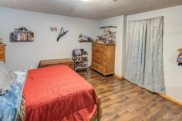 3448 Levee Rd, Centralia, IL 62801 - bedroom with wood finished floors, a textured ceiling, and baseboards