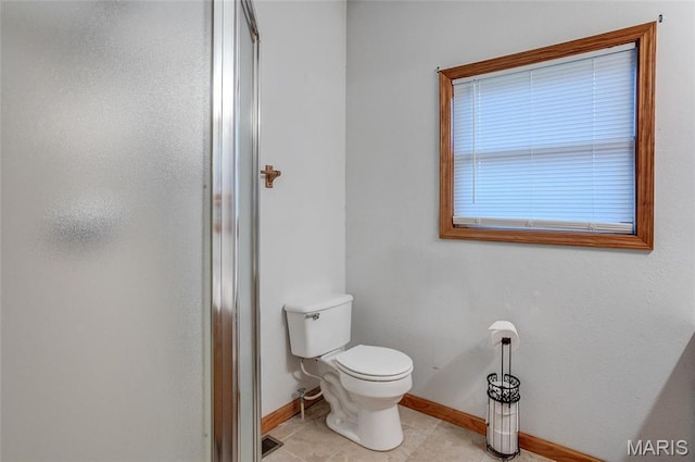 3448 Levee Rd, Centralia, IL 62801 - full bath with baseboards, a stall shower, toilet, and tile patterned flooring