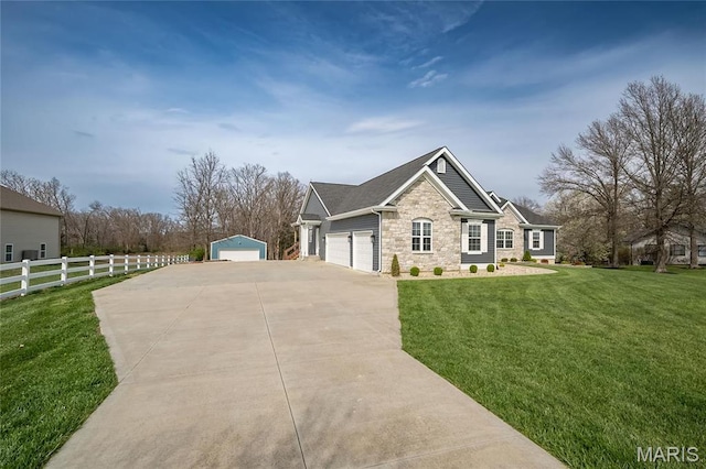 2181 Jarvis Rd, Foristell, MO 63348 - view of front of property with stone siding, concrete driveway, and an outdoor structure