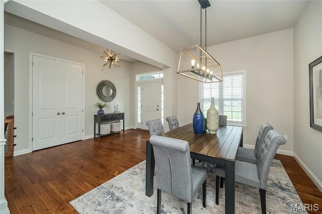 2181 Jarvis Rd, Foristell, MO 63348 - dining area featuring a chandelier, wood finished floors, and baseboards