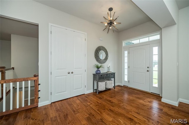 2181 Jarvis Rd, Foristell, MO 63348 - entrance foyer featuring a chandelier, wood finished floors, and baseboards