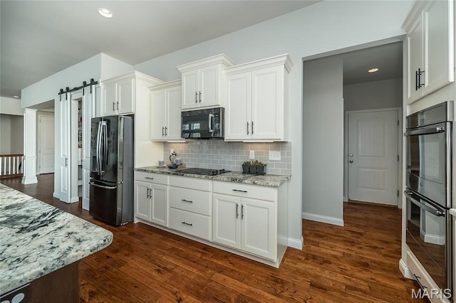 2181 Jarvis Rd, Foristell, MO 63348 - kitchen featuring black appliances, light stone countertops, decorative backsplash, white cabinetry, and dark wood-style flooring