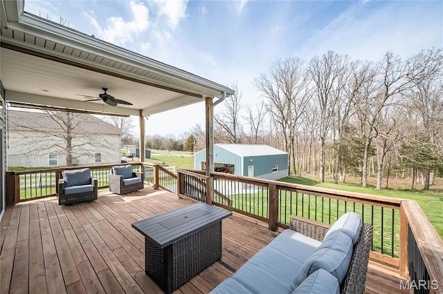 2181 Jarvis Rd, Foristell, MO 63348 - wooden deck with an outdoor living space, a ceiling fan, an outdoor structure, and a lawn