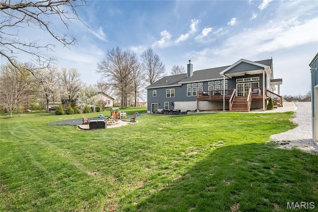 2181 Jarvis Rd, Foristell, MO 63348 - back of property with an outdoor fire pit, stairs, a wooden deck, a chimney, and a lawn
