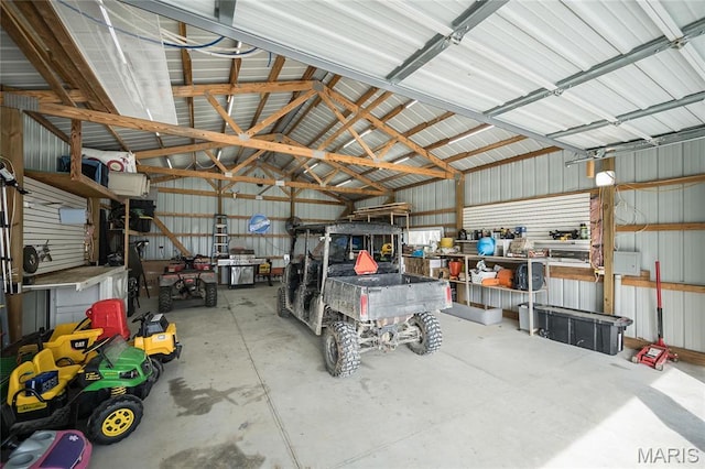 2181 Jarvis Rd, Foristell, MO 63348 - garage featuring a workshop area and metal wall