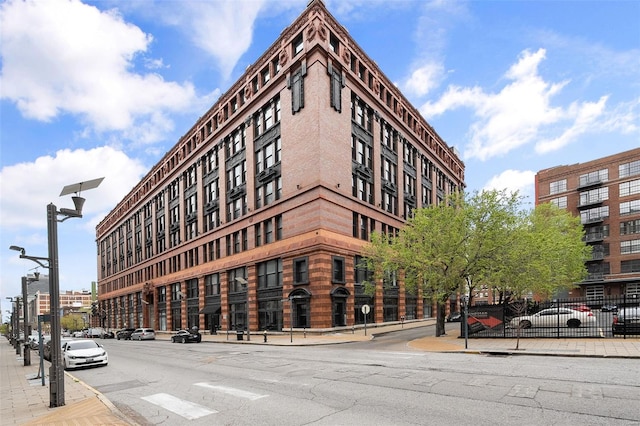 view of building exterior with fence