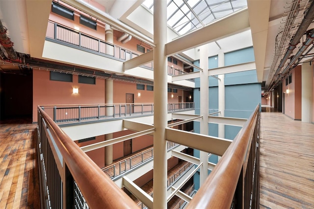 interior space featuring hardwood / wood-style floors and a high ceiling
