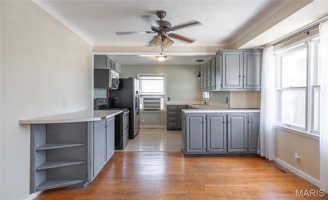 11 Rolla Gardens Dr, Rolla, MO 65401 - kitchen featuring stainless steel appliances, gray cabinetry, ceiling fan, open shelves, and a peninsula