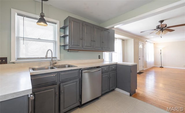 11 Rolla Gardens Dr, Rolla, MO 65401 - kitchen featuring stainless steel dishwasher, a sink, gray cabinetry, and light countertops