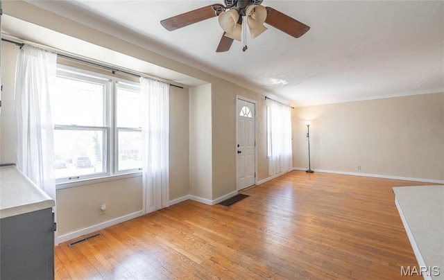 11 Rolla Gardens Dr, Rolla, MO 65401 - entryway with baseboards, light wood finished floors, healthy amount of natural light, and ceiling fan