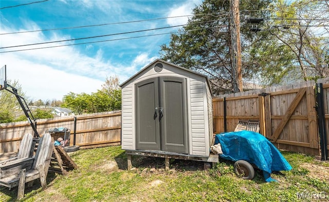 11 Rolla Gardens Dr, Rolla, MO 65401 - view of shed with a fenced backyard and a gate