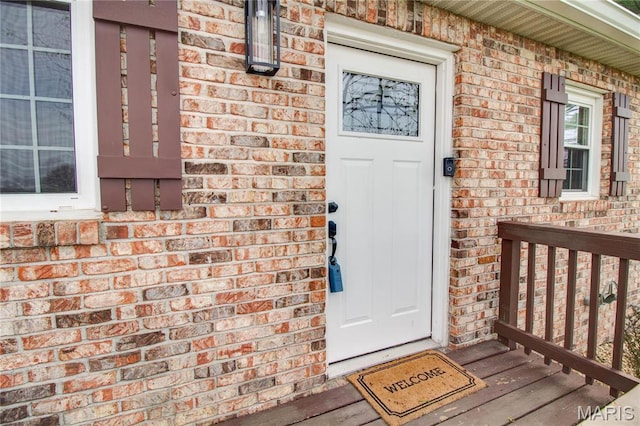 property entrance with brick siding