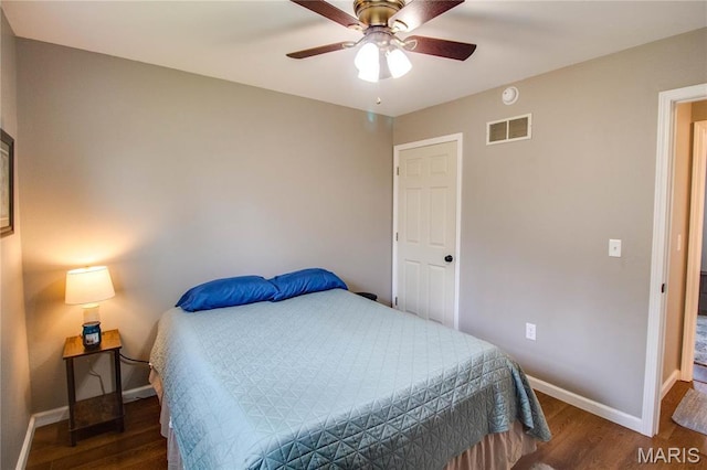 bedroom with wood finished floors, baseboards, and a ceiling fan