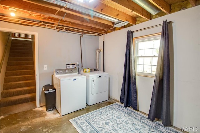 washroom featuring washer and dryer