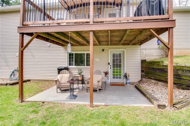 property entrance with a patio and a deck