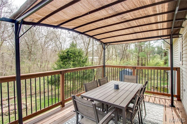 deck with outdoor dining area