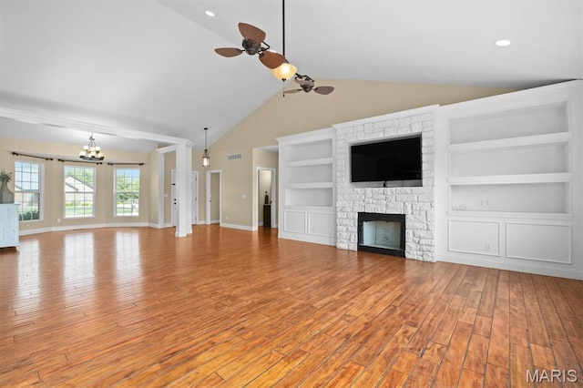 2 Arthurs Ct, Troy, IL 62294 - unfurnished living room with ceiling fan, a chandelier, light wood-style floors, baseboards, and built in features