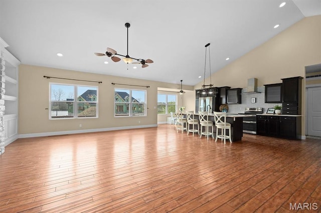 2 Arthurs Ct, Troy, IL 62294 - living area with light wood finished floors, plenty of natural light, high vaulted ceiling, recessed lighting, and ceiling fan